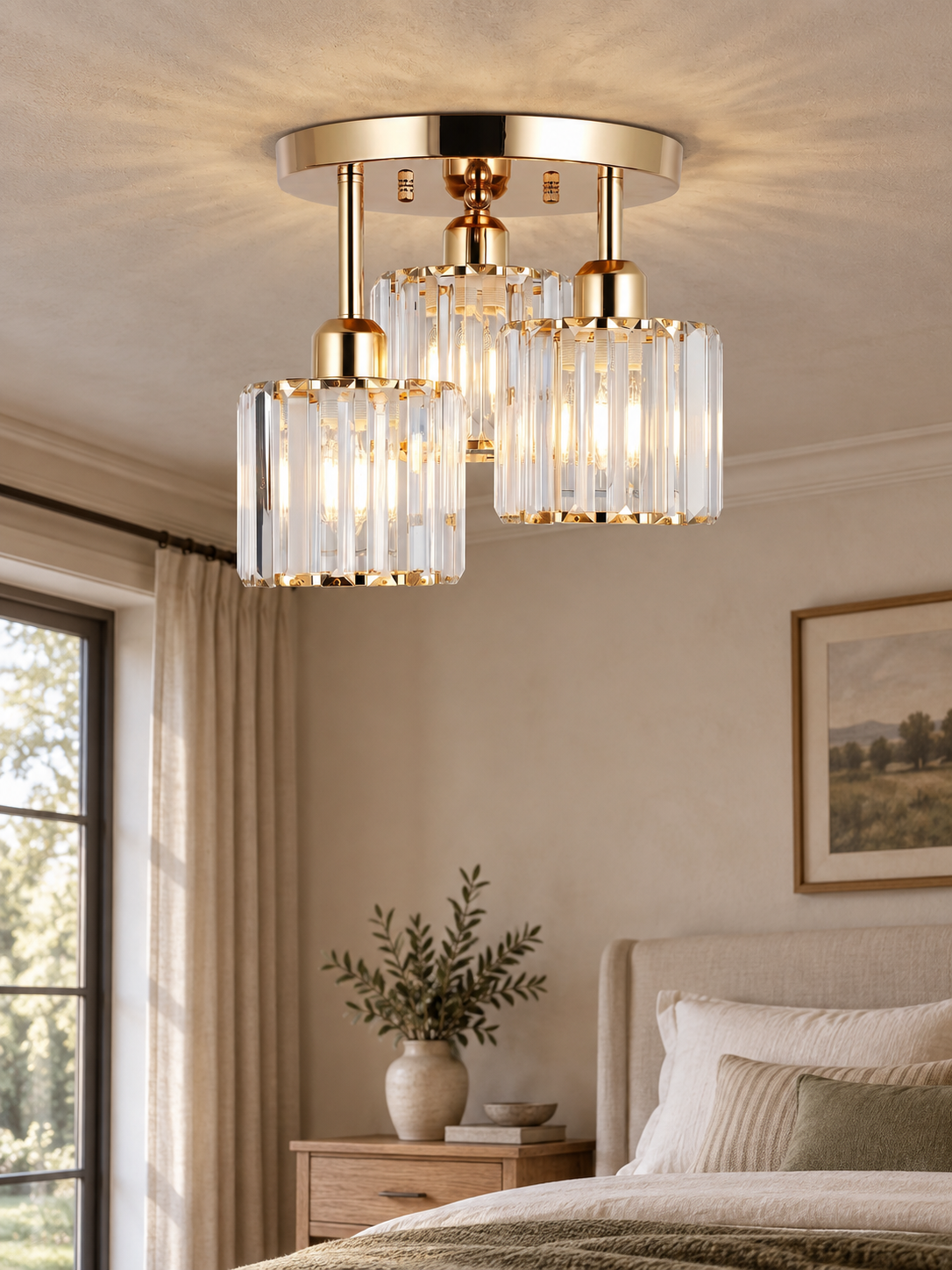 Gold three-shade crystal ceiling light in a warm bedroom.